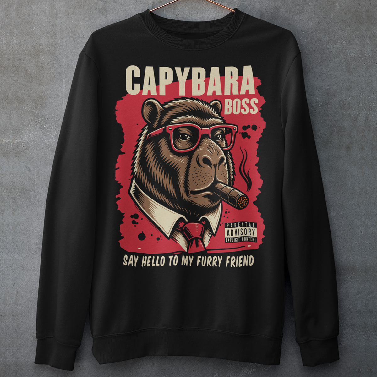 Black sweatshirt featuring a bold vintage-style capybara graphic wearing red sunglasses, a suit and tie, and smoking a cigar. The design includes “CAPYBARA BOSS” text, a red background, and the phrase “SAY HELLO TO MY FURRY FRIEND,” creating a funny gangster-inspired animal design for capybara lovers and meme fans.