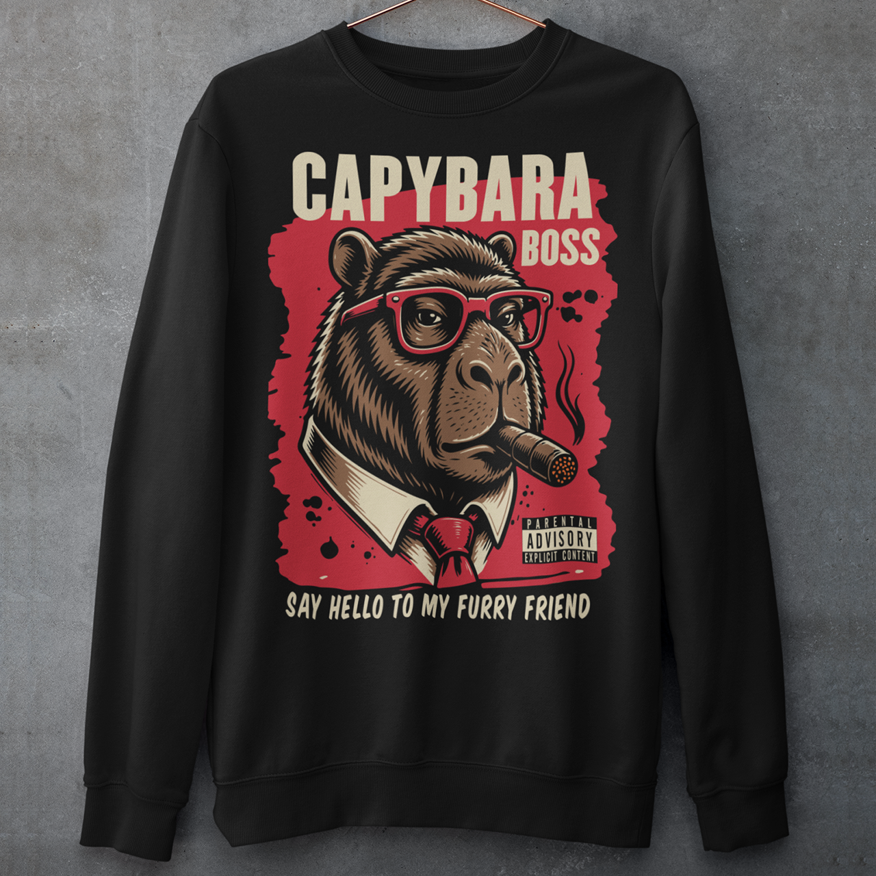 Black sweatshirt featuring a bold vintage-style capybara graphic wearing red sunglasses, a suit and tie, and smoking a cigar. The design includes “CAPYBARA BOSS” text, a red background, and the phrase “SAY HELLO TO MY FURRY FRIEND,” creating a funny gangster-inspired animal design for capybara lovers and meme fans.