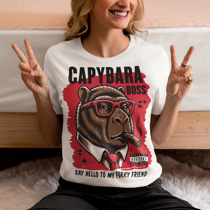 White t-shirt featuring a bold vintage-style capybara graphic wearing red sunglasses, a suit and tie, and smoking a cigar. The design includes “CAPYBARA BOSS” text, a red background, and the phrase “SAY HELLO TO MY FURRY FRIEND,” creating a funny gangster-inspired animal design for capybara lovers and meme fans.