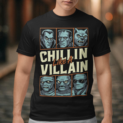 Black t-shirt featuring the phrase "Chillin Like A Villain" with six classic horror monster portraits, including a vampire, Frankenstein's monster, werewolf, mummy, swamp creature, and the Invisible Man. The retro-inspired graphic uses distressed vintage styling with bold cream and orange lettering, making it a fun horror-themed shirt for Halloween, monster movie fans, goth fashion lovers, and classic horror enthusiasts.