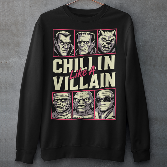 Black sweatshirt featuring the phrase "Chillin Like A Villain" with six classic horror monster portraits, including a vampire, Frankenstein's monster, werewolf, mummy, swamp creature, and the Invisible Man. The retro-inspired graphic uses distressed vintage styling with bold cream and pink lettering, making it a fun horror-themed shirt for Halloween, monster movie fans, goth fashion lovers, and classic horror enthusiasts.