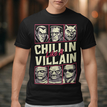 Black t-shirt featuring the phrase "Chillin Like A Villain" with six classic horror monster portraits, including a vampire, Frankenstein's monster, werewolf, mummy, swamp creature, and the Invisible Man. The retro-inspired graphic uses distressed vintage styling with bold cream and pink lettering, making it a fun horror-themed shirt for Halloween, monster movie fans, goth fashion lovers, and classic horror enthusiasts.