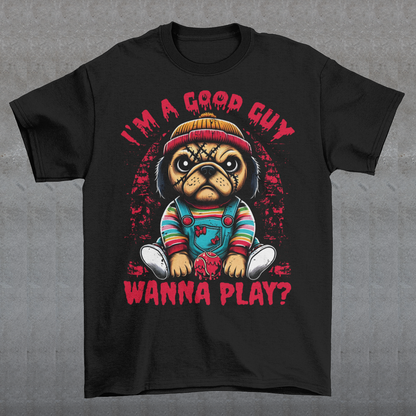 Introducing our "Chucky Pug" t-shirt, where cuteness meets a hint of horror! This unique design features an adorably sinister pug dressed as the infamous Chucky, complete with striped shirt, and overalls. The pug's mischievous expression adds a playful twist to the creepy vibe. Above the pug, bold text reads "I'M A GOOD GUY," a cheeky nod to the iconic character's deceptive charm. Below the image, the phrase "WANNA PLAY?" adds a chilling yet humorous touch.