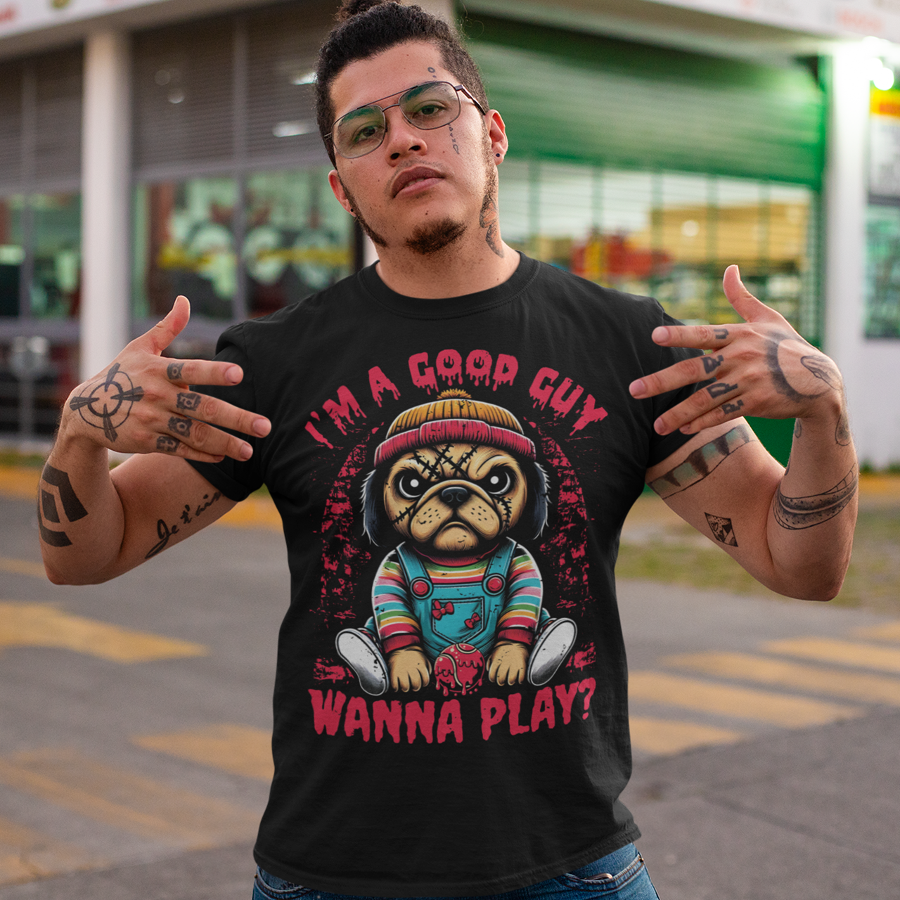 Black t-shirt of a Chucky Pug with text above "I'M A GOOD GUY". Text below WANNA PLAY?