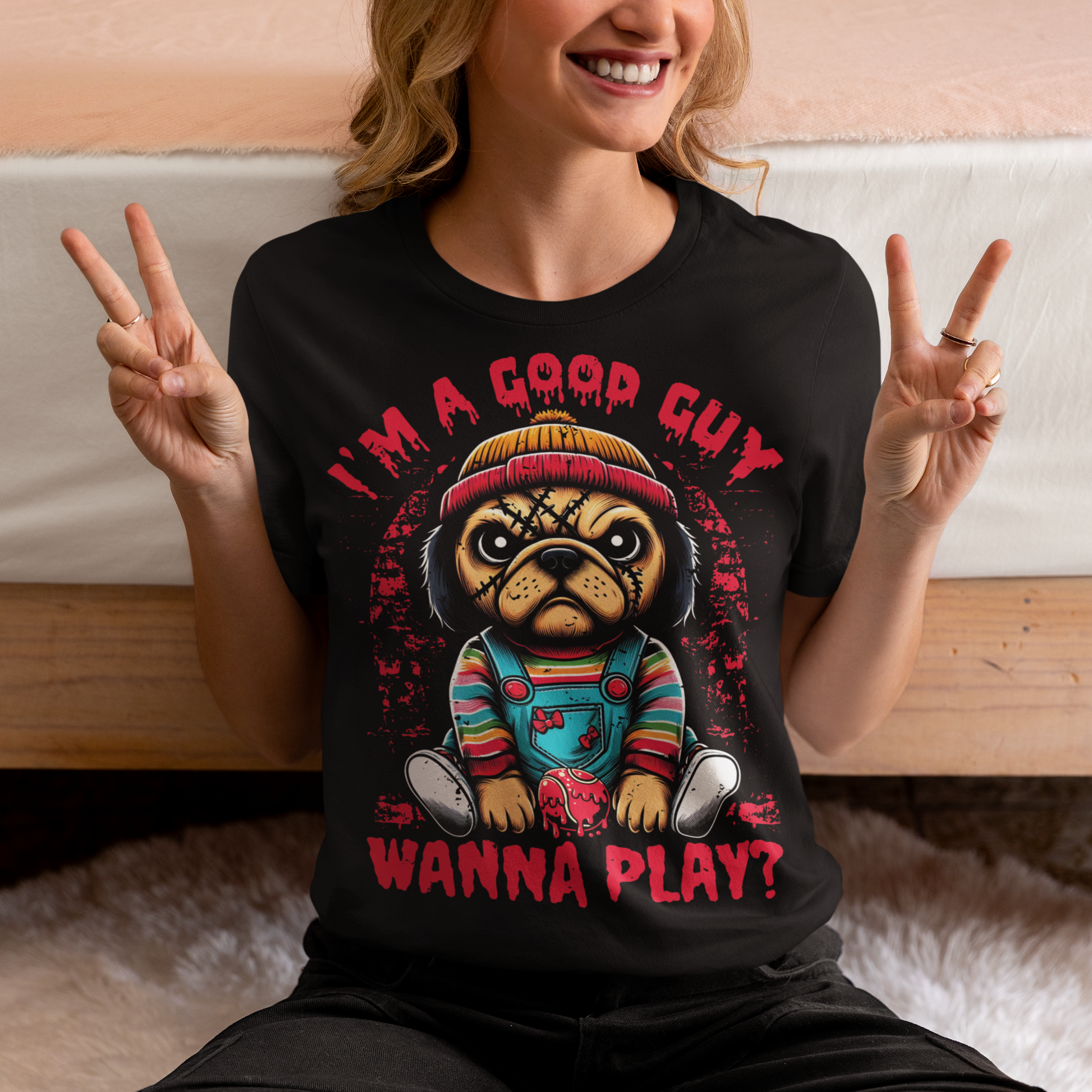 Black t-shirt of a Chucky Pug with text above "I'M A GOOD GUY". Text below WANNA PLAY?