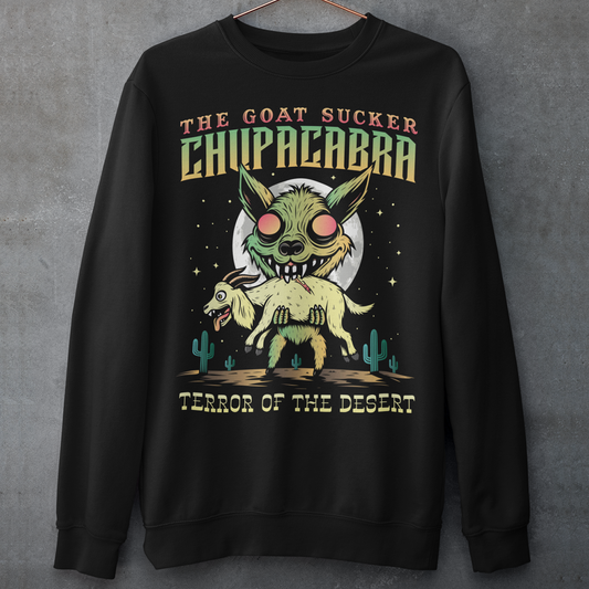 Black sweatshirt of a chupacabra sucking on a goat in the desert with text above THE GOAT SUCKER CHUPACABRA ang text below TERROR OF THE DESERT.