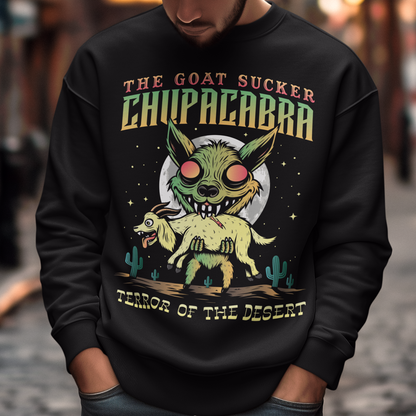 Black sweatshirt of a chupacabra sucking on a goat in the desert with text above THE GOAT SUCKER CHUPACABRA ang text below TERROR OF THE DESERT.