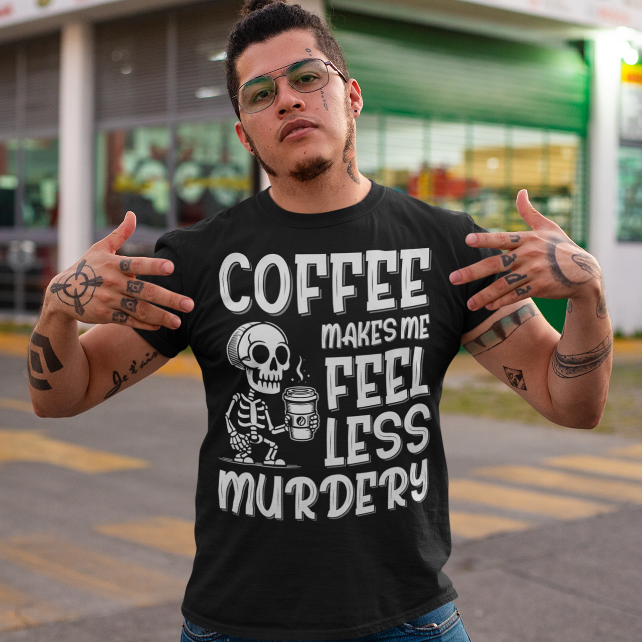 Introducing our "Coffee Makes Me Feel Less Murdery" T-Shirt – the perfect blend of dark humor and everyday caffeine dependence. This unique design features a laid-back skeleton holding a steaming cup of coffee, perfectly capturing the sentiment that a good brew can make even the most undead feel more alive. The bold text "COFFEE MAKES ME FEEL LESS MURDERY" adds a cheeky twist, making this shirt a must-have for coffee lovers with a quirky sense of humor.