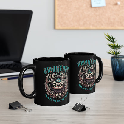Black mug of a sloth with a third eye with text above AWAKENED and text below THIS IS MY HAPPY PLACE.