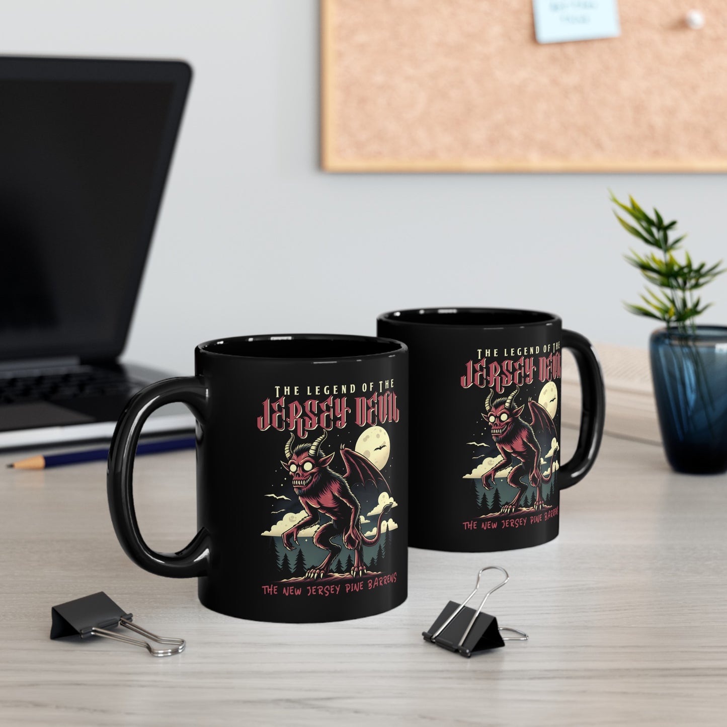 Black mug of the Jersey Devil with text above THE LEGEND OF THE JERSEY DEVIL and text below THE NEW JERSEY PINE BARRENS.