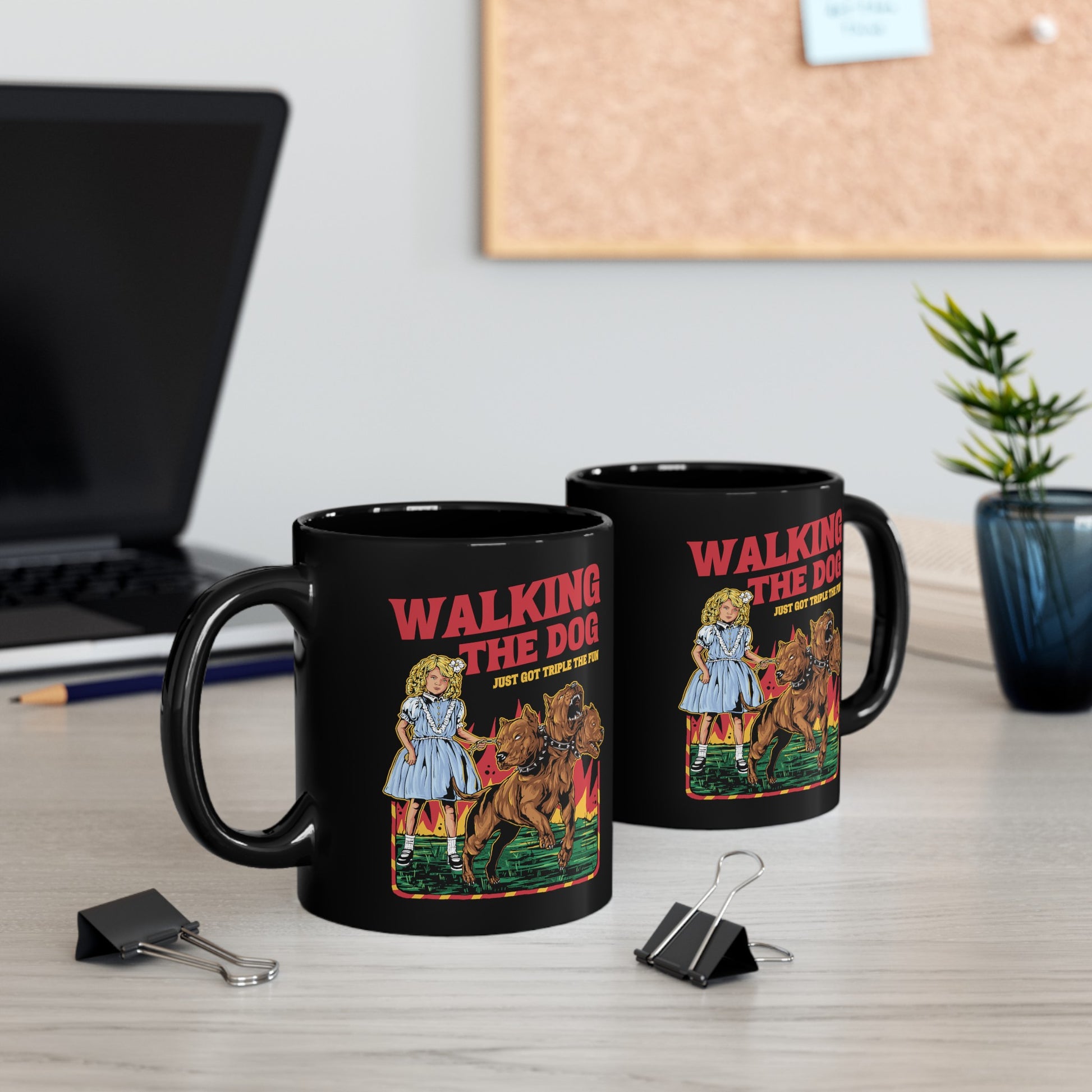 Black mug of a girl taking Cerberus dog for a walk with text WALKING THE DOG JUST GOT TRIPLE THE FUN.