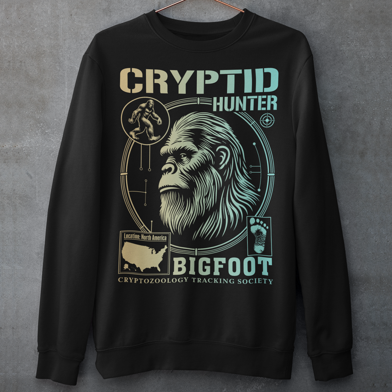 Illustration of a cryptozoology-themed sweatshirt featuring a stylized image of Bigfoot's head, shown with shaggy fur, deep-set eyes, and a mysterious expression. The artwork has a bold, rugged design in earthy tones, emphasizing the mythical nature of the creature. Above the image, the words "CRYPTID HUNTER" are prominently displayed in large, distressed lettering, suggesting adventure and mystery. The design appeals to fans of folklore, legends, and unexplained phenomena.