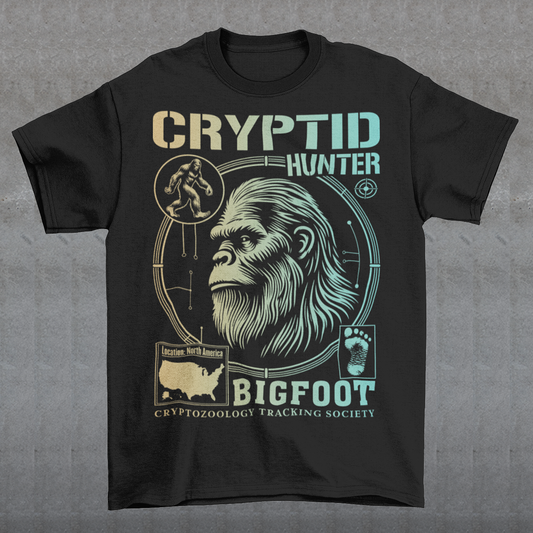 Illustration of a cryptozoology-themed t-shirt featuring a stylized image of Bigfoot's head, shown with shaggy fur, deep-set eyes, and a mysterious expression. The artwork has a bold, rugged design in earthy tones, emphasizing the mythical nature of the creature. Above the image, the words "CRYPTID HUNTER" are prominently displayed in large, distressed lettering, suggesting adventure and mystery. The design appeals to fans of folklore, legends, and unexplained phenomena.