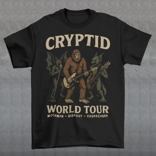 Rock out with legends from beyond the myths! This bold graphic tee features Mothman, Bigfoot, and the Chupacabra shredding as a rock band, headlining the CRYPTID WORLD TOUR. With vintage concert-poster vibes, it’s the perfect blend of spooky lore and rock ’n’ roll energy.