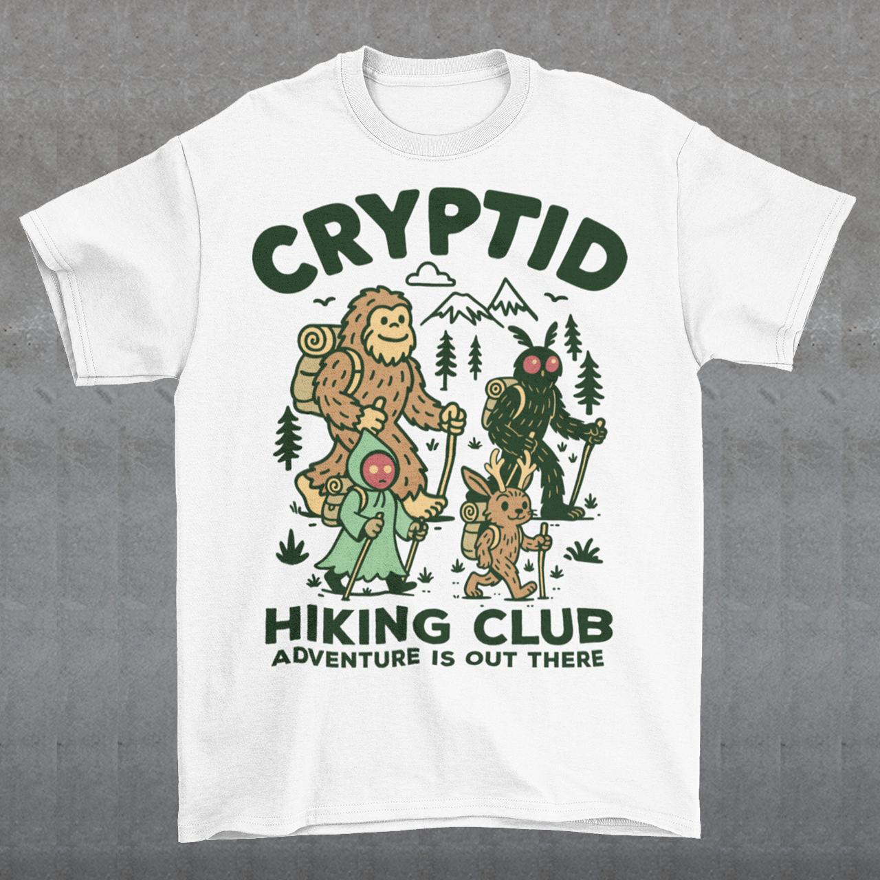 White t-shirt featuring a playful “Cryptid Hiking Club” design with Bigfoot, Mothman, flatwoods monster, and a jackalope hiking together through a forest trail. The artwork includes mountains, pine trees, backpacks, and trekking poles with the slogan “Adventure Is Out There.” A fun outdoor-themed graphic perfect for cryptid fans, hikers, campers, paranormal enthusiasts, and lovers of folklore-inspired apparel.