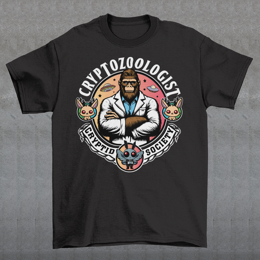 Introducing our enigmatic Cryptozoologist t-shirt, where the mysteries of the unknown converge in an eye-catching design! Picture this: a towering Bigfoot, not merely a creature of folklore, but an esteemed scientist of the wilderness. Behind this enigmatic figure, the night sky is alive with the shimmering presence of UFOs, hinting at extraterrestrial encounters and the secrets they may hold.