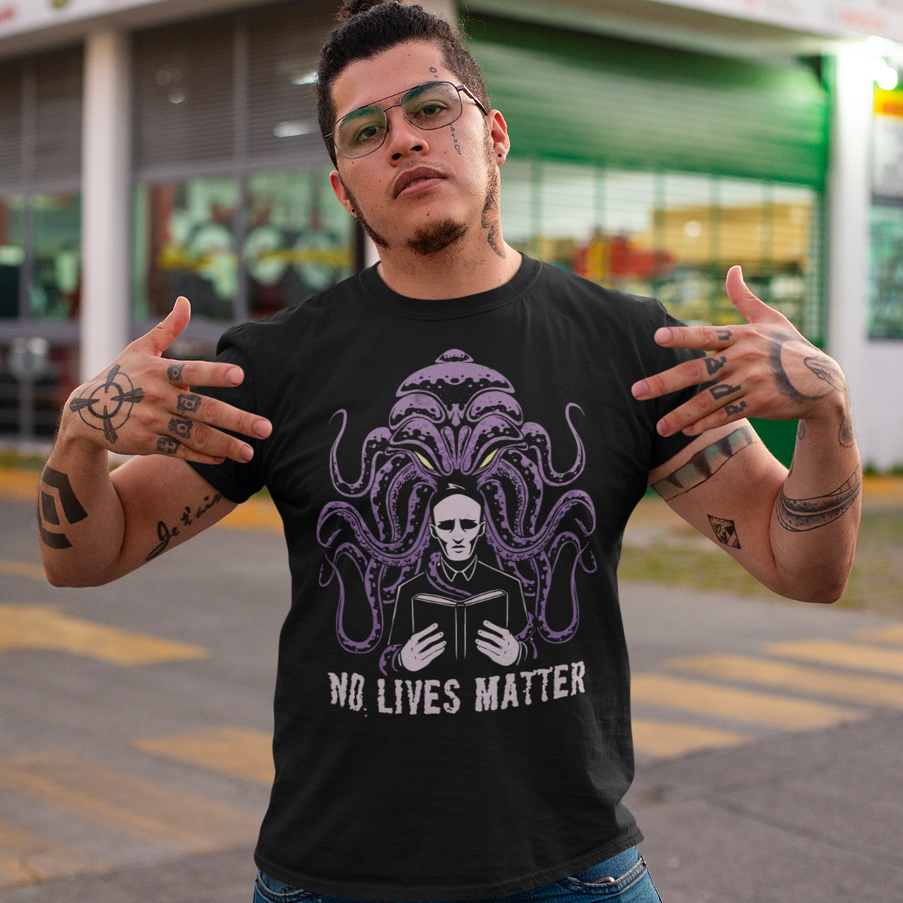 Black t-shirt of Cthulhu behind a priest with text underneath NO LIVES MATTER.