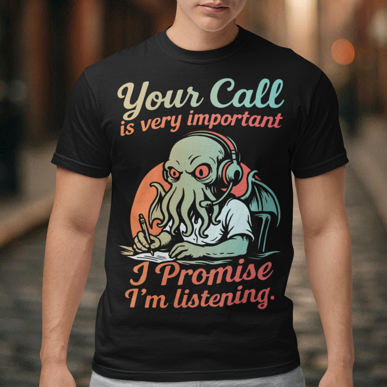 This tee drops Cthulhu into the fluorescent glow of a call centre desk, headset perched, tentacles multitasking like a cosmic customer-service pro. The vintage colors and playful lettering give it a warm, retro hum while the great old one pretends to take notes. It’s a perfect pick for anyone who has survived hold music, worships dark humor, or simply enjoys mythic chaos wrapped in office casual.