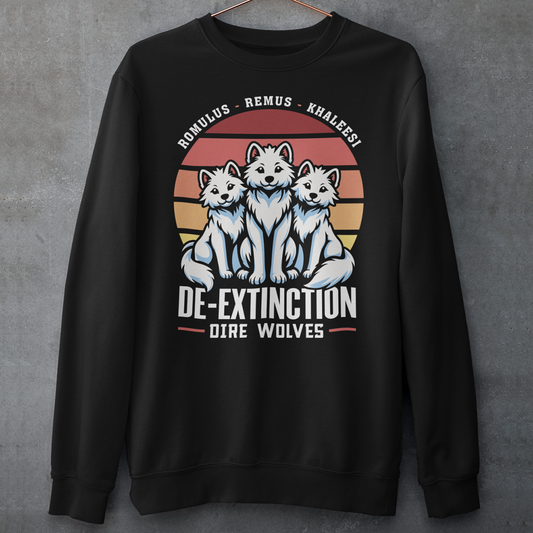Black sweatshirt of three Dire Wolves sitting in front of a retro sun with text below DE-EXTINCTION.