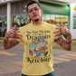 Yellow t-shirt of a dragon holding a bottle of ketchup standing behind a viking  with text DO NOT MEDDLE IN THE AFFAIRS OF DRAGONS FOR YOU ARE GOOD WITH KETCHUP.