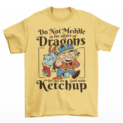 Yellow t-shirt of a dragon holding a bottle of ketchup standing behind a viking  with text DO NOT MEDDLE IN THE AFFAIRS OF DRAGONS FOR YOU ARE GOOD WITH KETCHUP.