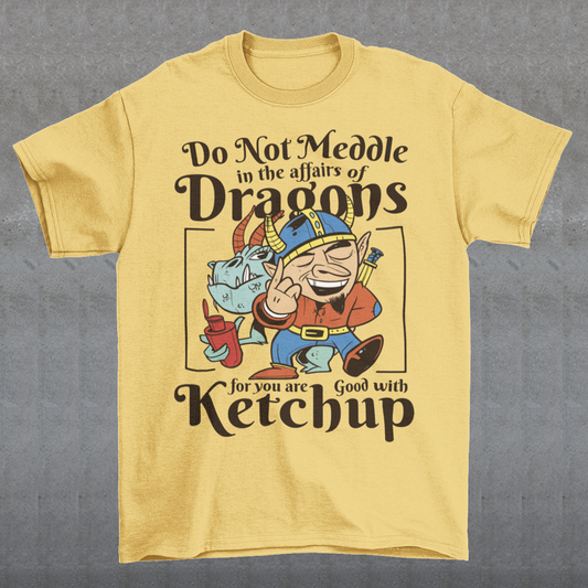 Introducing our whimsically fierce and flavorful "Dragon Connoisseur" T-shirt! This eye-catching design features a majestic dragon with a mischievous grin, proudly holding a bottle of ketchup, standing ominously behind a brave Viking. The caption, "DO NOT MEDDLE IN THE AFFAIRS OF DRAGONS FOR YOU ARE GOOD WITH KETCHUP," adds a touch of humor and a warning to all who dare to challenge the fiery and saucy taste preferences of these mythical creatures.