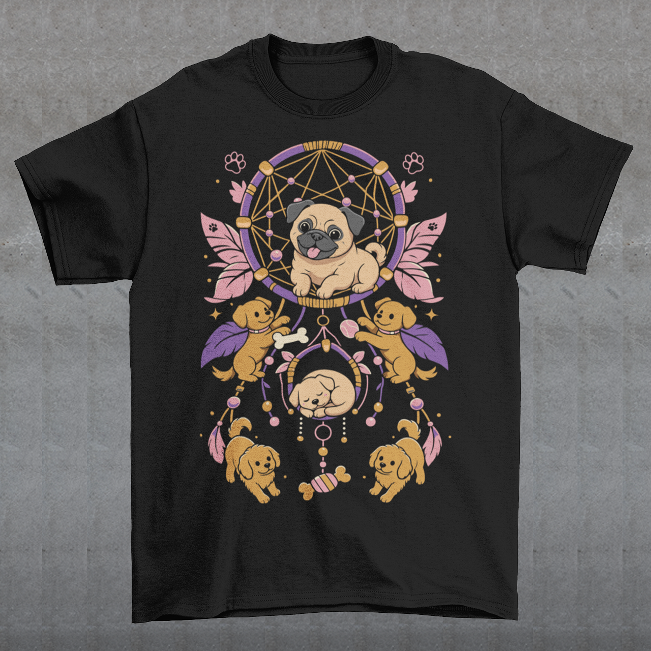 Black t-shirt featuring a colorful boho dog dream catcher design filled with adorable pug puppies. The artwork includes a central pug surrounded by smaller dogs, feathers, beads, paw prints, dog bones, and a sleeping puppy, creating a playful and whimsical pet-themed graphic. Perfect for pug lovers, dog moms, puppy enthusiasts, and fans of cute bohemian dog apparel.