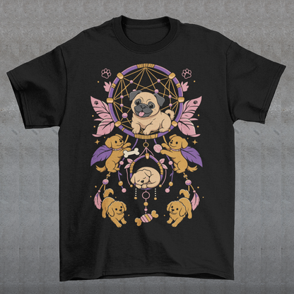 Black t-shirt featuring a colorful boho dog dream catcher design filled with adorable pug puppies. The artwork includes a central pug surrounded by smaller dogs, feathers, beads, paw prints, dog bones, and a sleeping puppy, creating a playful and whimsical pet-themed graphic. Perfect for pug lovers, dog moms, puppy enthusiasts, and fans of cute bohemian dog apparel.