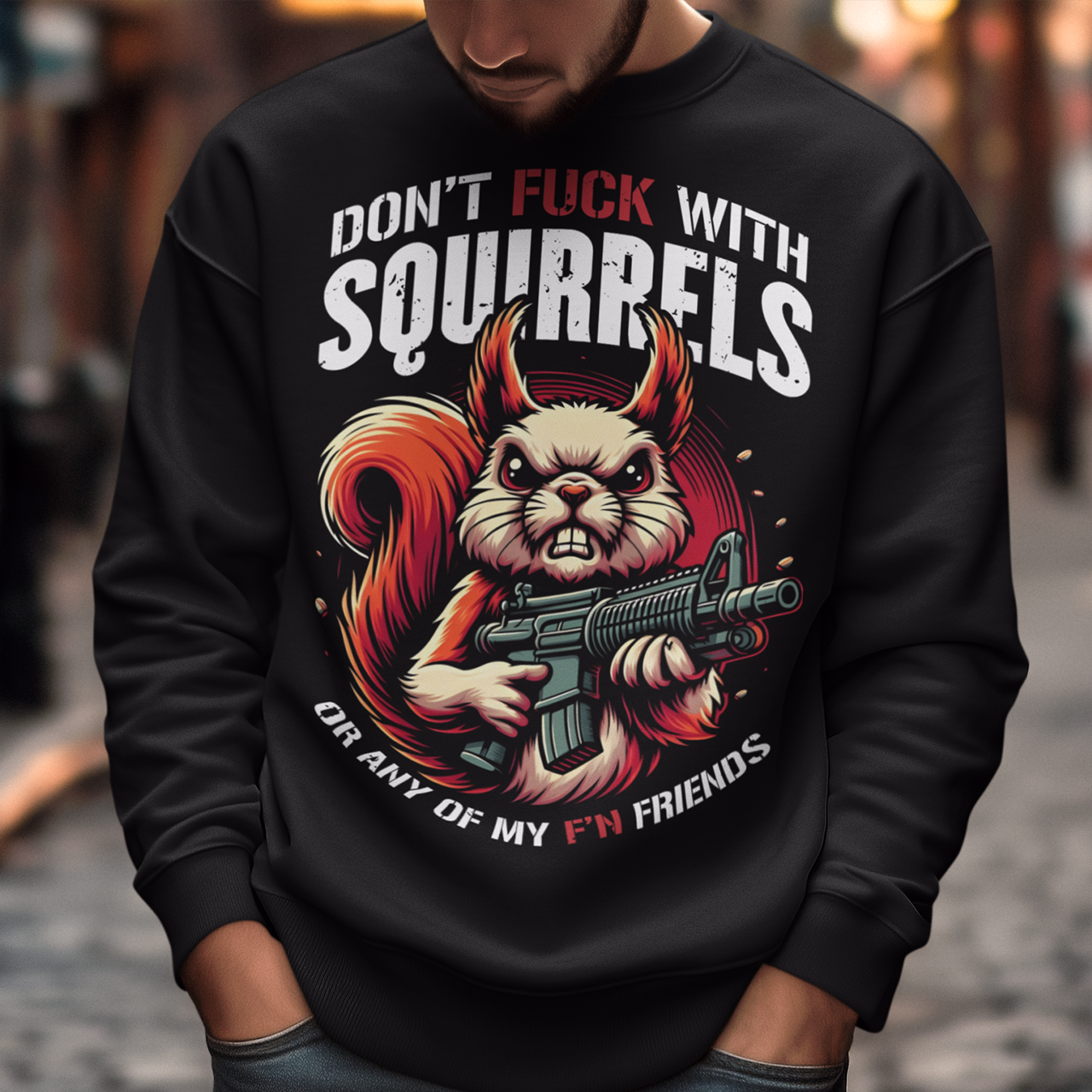 Black sweatshirt of a squirrel with a gun with text above "DON'T FUCK WITH SQUIRRELS" and text below "OR ANY OF MY F'N FRIENDS".