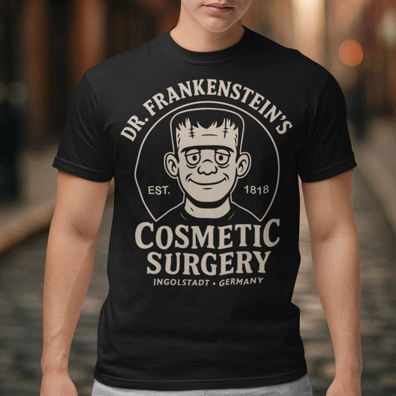 Bring classic horror and dark humor together with our Dr. Frankenstein’s Cosmetic Surgery t-shirt — a cozy, retro-style design featuring a cartoonish Frankenstein’s monster and vintage badge artwork. Perfect for fans of classic monsters, gothic aesthetics, and clever parody, this shirt delivers comfy warmth with a bold, tongue-in-cheek twist. Whether you’re dressing for spooky season, horror-themed events, or just love unique graphic apparel, this shirt makes an eye-catching statement.