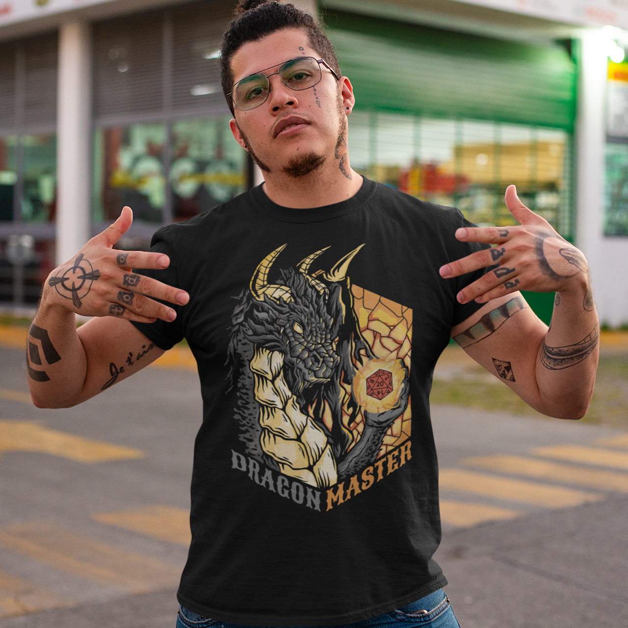 Black t-shirt of a dragon holding an rpg dice with text underneath "DRAGON MASTER".