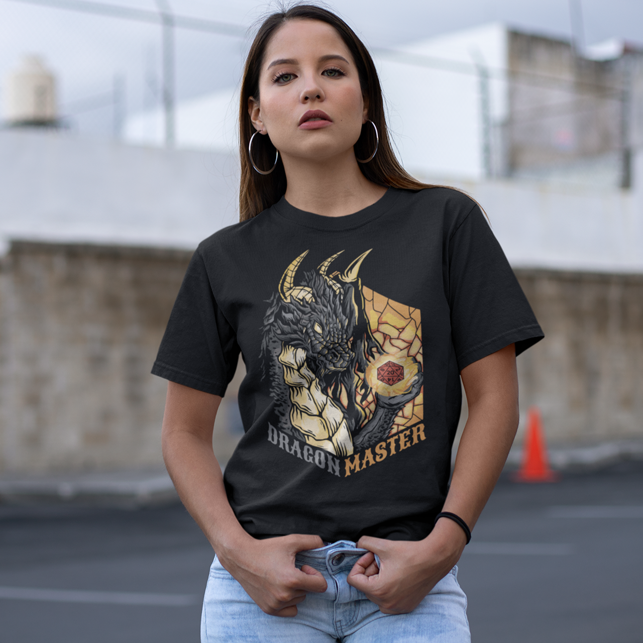 Black t-shirt of a dragon holding an rpg dice with text underneath "DRAGON MASTER".