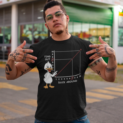 Duck Around Find Out T-Shirt - Funny Duck Shirt - Meme Humor Tee. Black t-shirt featuring a cartoon duck pointing at a graph with a rising red line. The chart includes numbers and labels reading “Find Out” on the vertical axis and “Duck Around” on the horizontal axis, with the number 7 highlighted. The design is a humorous visual pun based on a popular phrase, combining a cute duck illustration with a witty, sarcastic chart style.