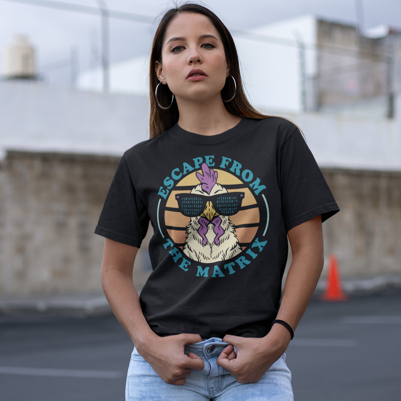 Black t-shirt with a rooster in singlasses in front of a retro sunset with text "ESCAPE FROM THE MATRIX".