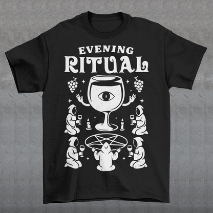 Black t-shirt featuring a white occult-style graphic with the text “Evening Ritual.” Design shows hooded figures gathered around a pentagram performing a ritual with wine glasses, candles, grapes, and a large mystical wine goblet with an eye symbol. Spooky gothic and illuminati-inspired humor combined with wine lover aesthetics.