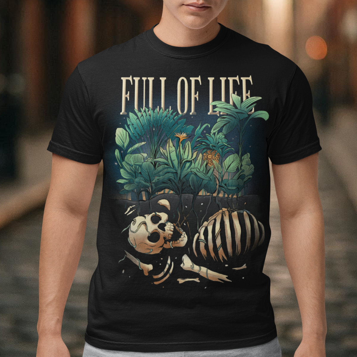 Introducing our captivating "Full of Life" T-shirt, where the beauty of nature intertwines with a touch of mystery. This unique design features a stunning depiction of lush plants flourishing over a buried skeleton, creating a striking visual contrast. The intricate artwork showcases the circle of life and the resilience of nature as it reclaims what was once lost. The vibrant green foliage and delicate flowers symbolize growth, renewal, and the everlasting cycle of existence.
