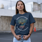 Navy t-shirt with a person meditating at the tree of life in space with text "FREE YOUR MIND FIND YOUR ROOTS".