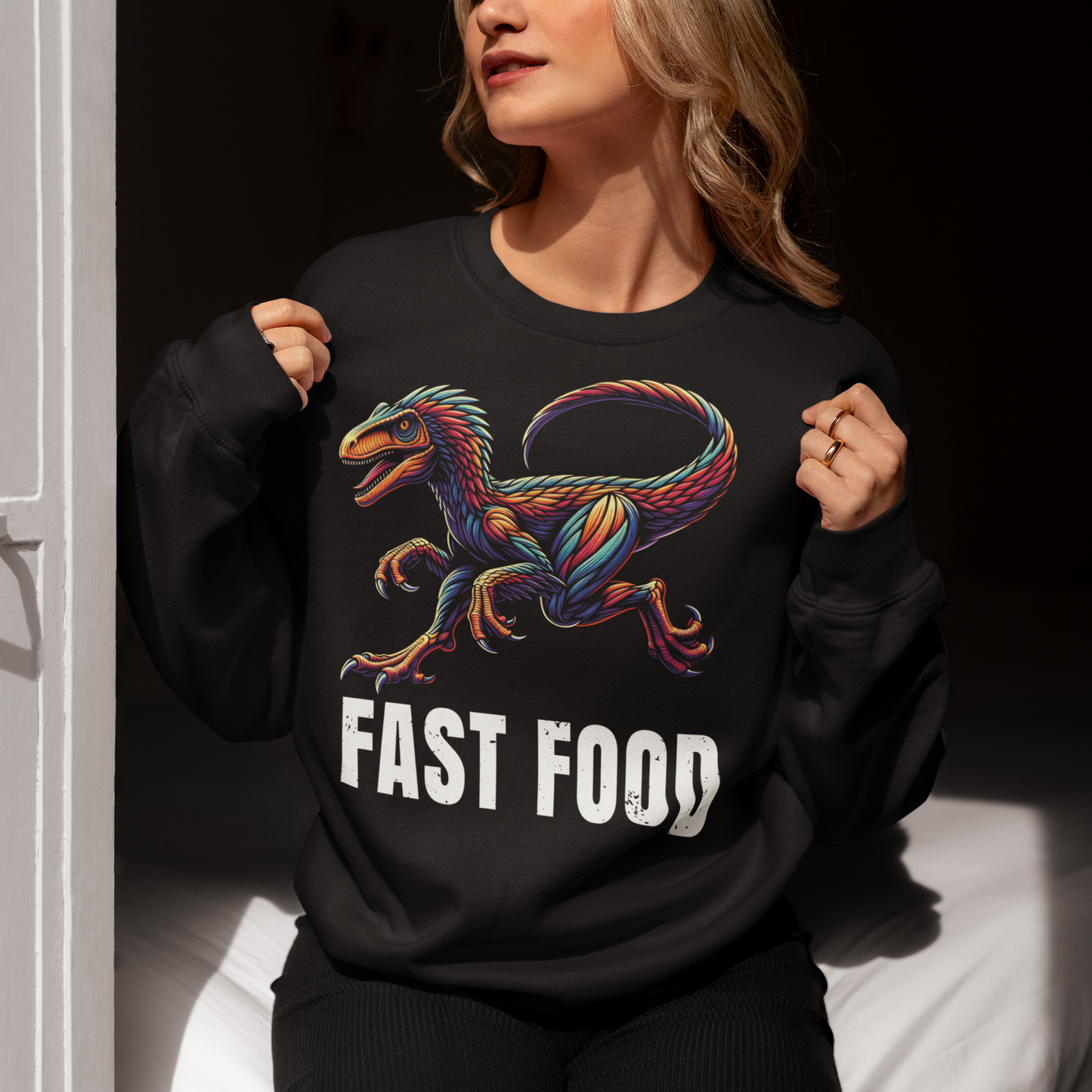 Black sweatshirt of a raptor with text underneath FAST FOOD.