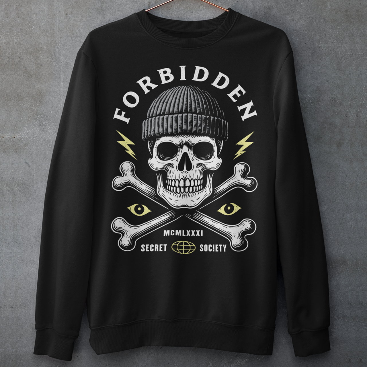 At the center sits a stark skull in a knit beanie, framed by crossed bones, watchful eyes, and crackling lightning bolts. Bold lettering reads Forbidden, with subtle details like Roman numerals and “Secret Society” giving the design the air of an underground emblem or outlaw insignia. The muted cream and acid-yellow accents pop against the black fabric, creating a gritty, modern occult aesthetic.