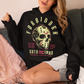 Black hoodie of a horror hockey mask and text "FORBIDDEN SECRET SOCIETY AWAKENED FROM THE DEAD." 