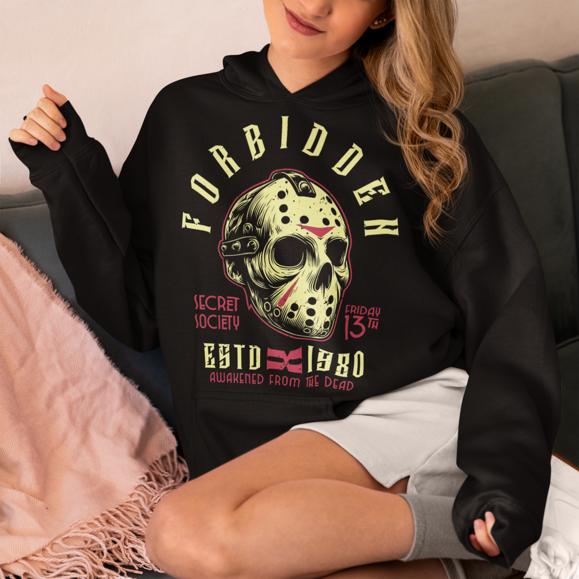 Black hoodie of a horror hockey mask and text "FORBIDDEN SECRET SOCIETY AWAKENED FROM THE DEAD." 