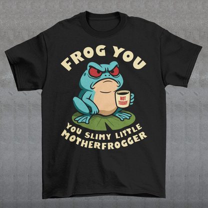 Frog You Motherfrogger T-Shirt - Angry Frog Shirt - Funny Animal Meme Tee - Frog Lover Gift. Serve attitude with a side of caffeine in this bold and hilarious “Frog Off Motherfrogger” shirt. Featuring a grumpy frog perched on a lily pad, clutching a “Not Today” coffee mug, this design perfectly captures those moods when patience is low and sarcasm is high. With its cheeky wordplay and expressive character, it’s the ultimate statement piece for anyone who appreciates humor with a bite.