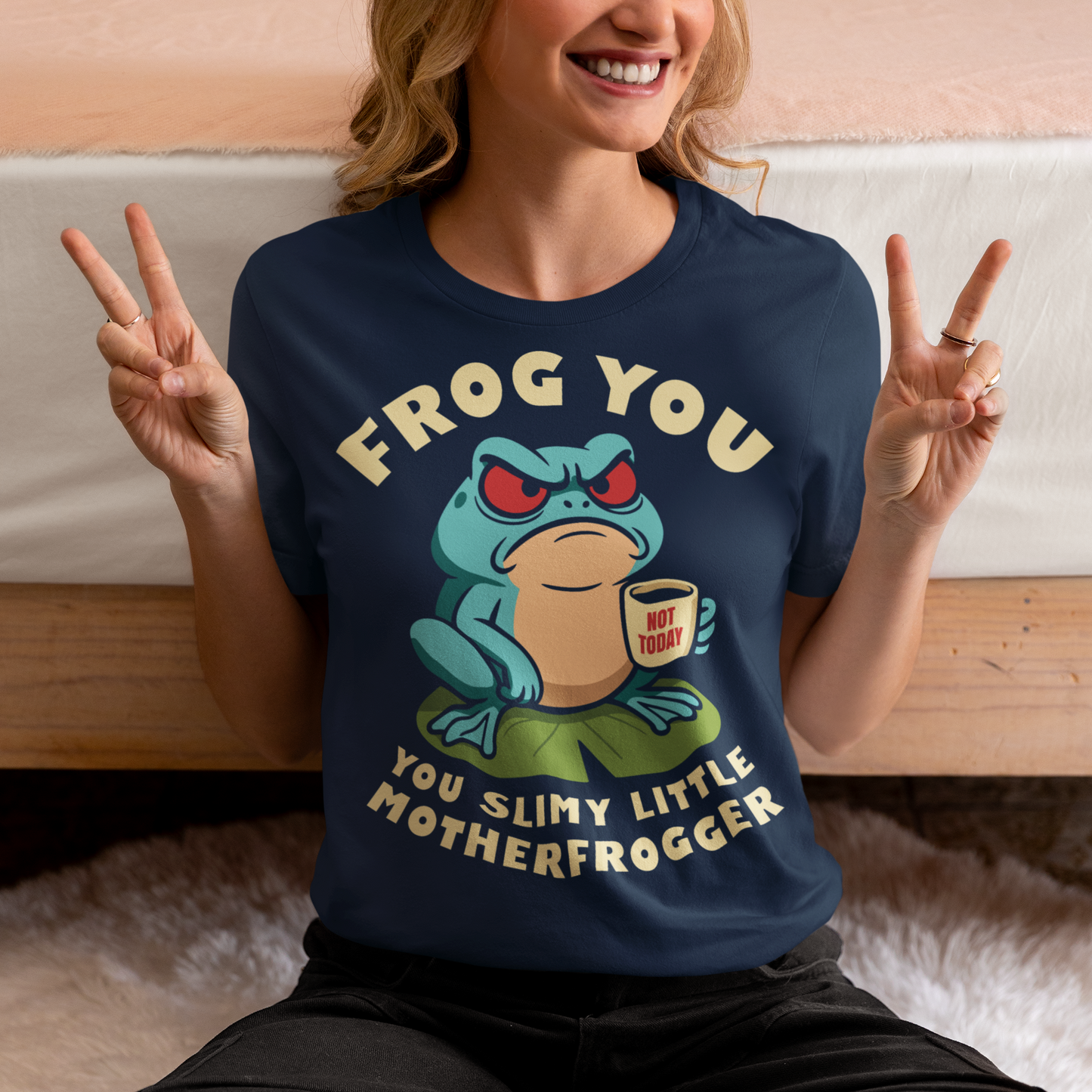 Frog You Motherfrogger T-Shirt - Angry Frog Shirt - Funny Animal Meme Tee - Frog Lover Gift. Serve attitude with a side of caffeine in this bold and hilarious “Frog Off Motherfrogger” shirt. Featuring a grumpy frog perched on a lily pad, clutching a “Not Today” coffee mug, this design perfectly captures those moods when patience is low and sarcasm is high. With its cheeky wordplay and expressive character, it’s the ultimate statement piece for anyone who appreciates humor with a bite.