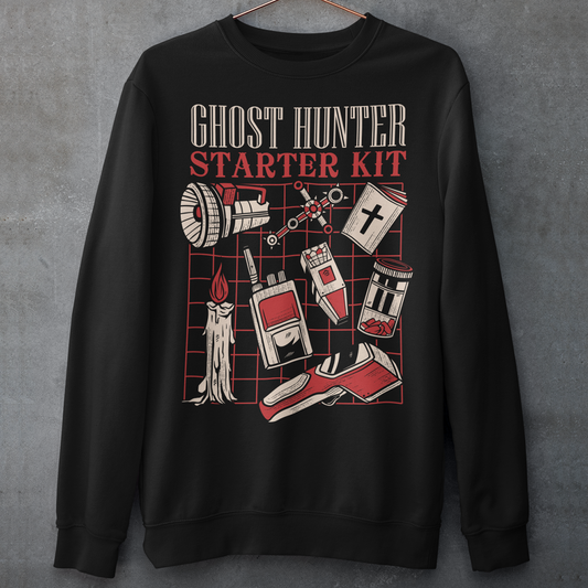 Step into the shadows with this Ghost Hunter Starter Kit sweatshirt, a perfect blend of spooky humor and paranormal adventure. Designed for fans of ghost hunting, horror culture, and all things supernatural, this bold graphic tee features a vintage-style layout packed with classic ghost hunting essentials like an EMF reader, flashlight, candle, spirit box, holy book, and more. The striking red and off-white artwork pops against the black fabric, giving it a retro paranormal investigator vibe.