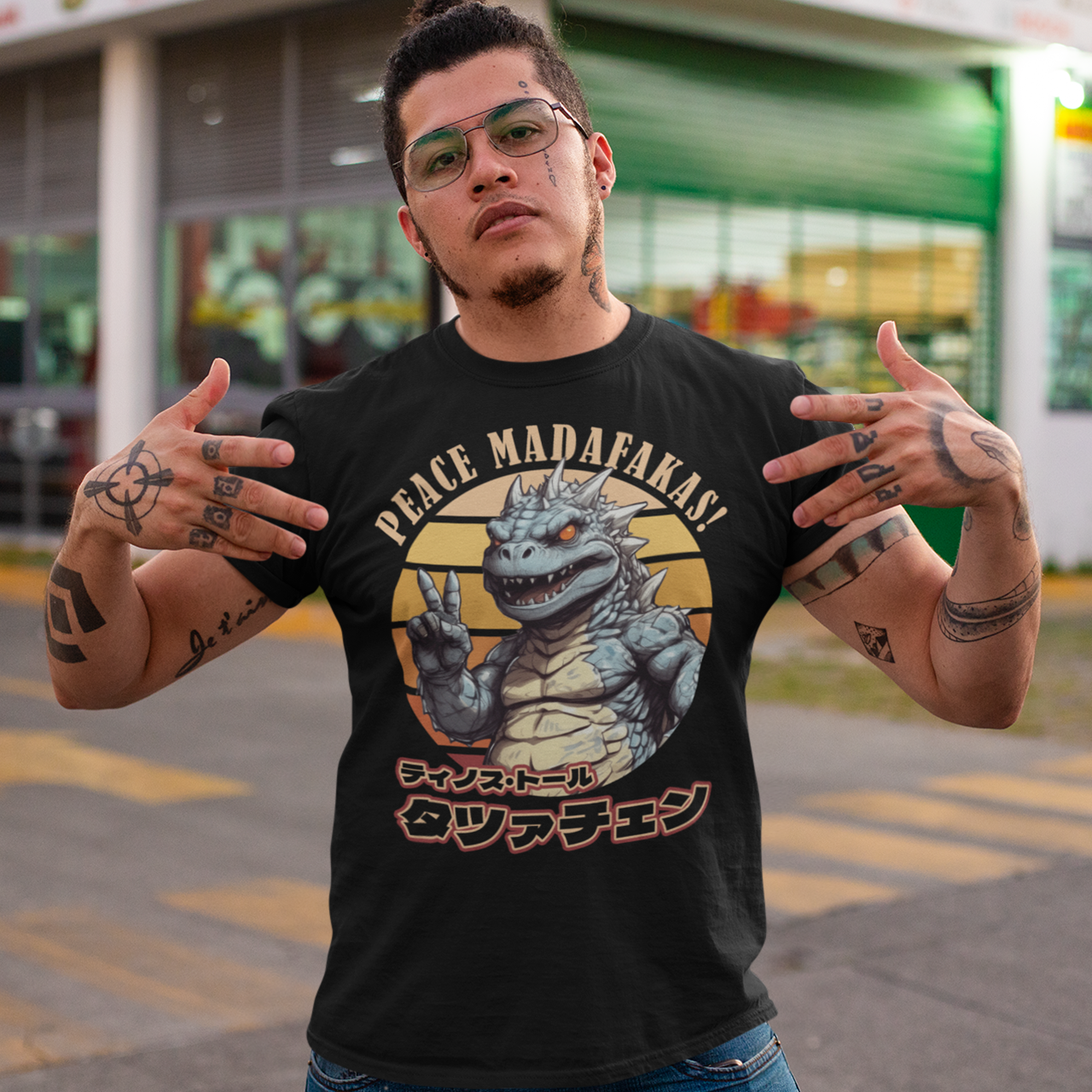 Black t-shirt of Godzilla in front of a retro sun with text PEACE MADAFAKAS!.