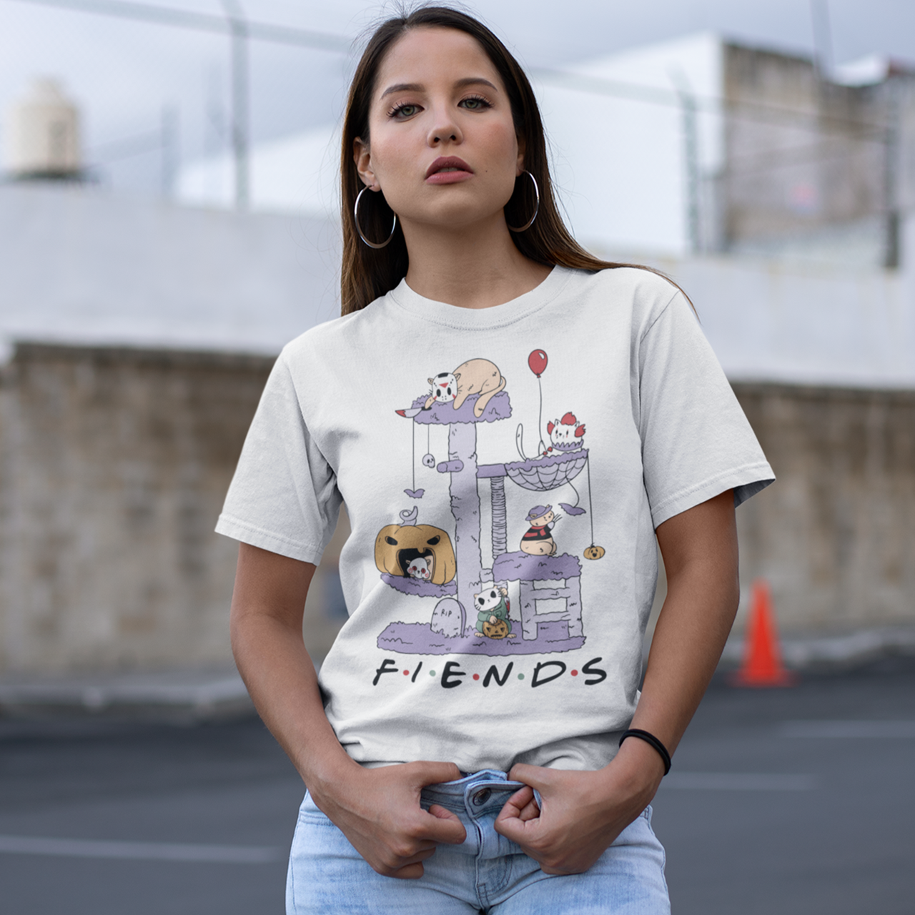 White halloween t-shirt of horror cat characters on a cat tree with text  "FIENDS".