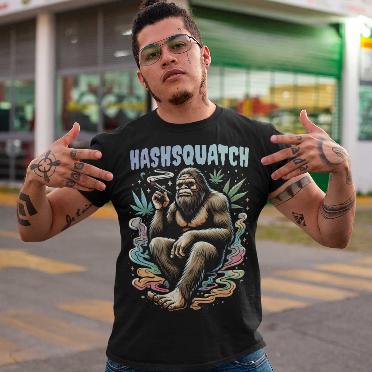 Black t-shirt of a Sasquatch smoking weed with text above HASHSQUATCH.