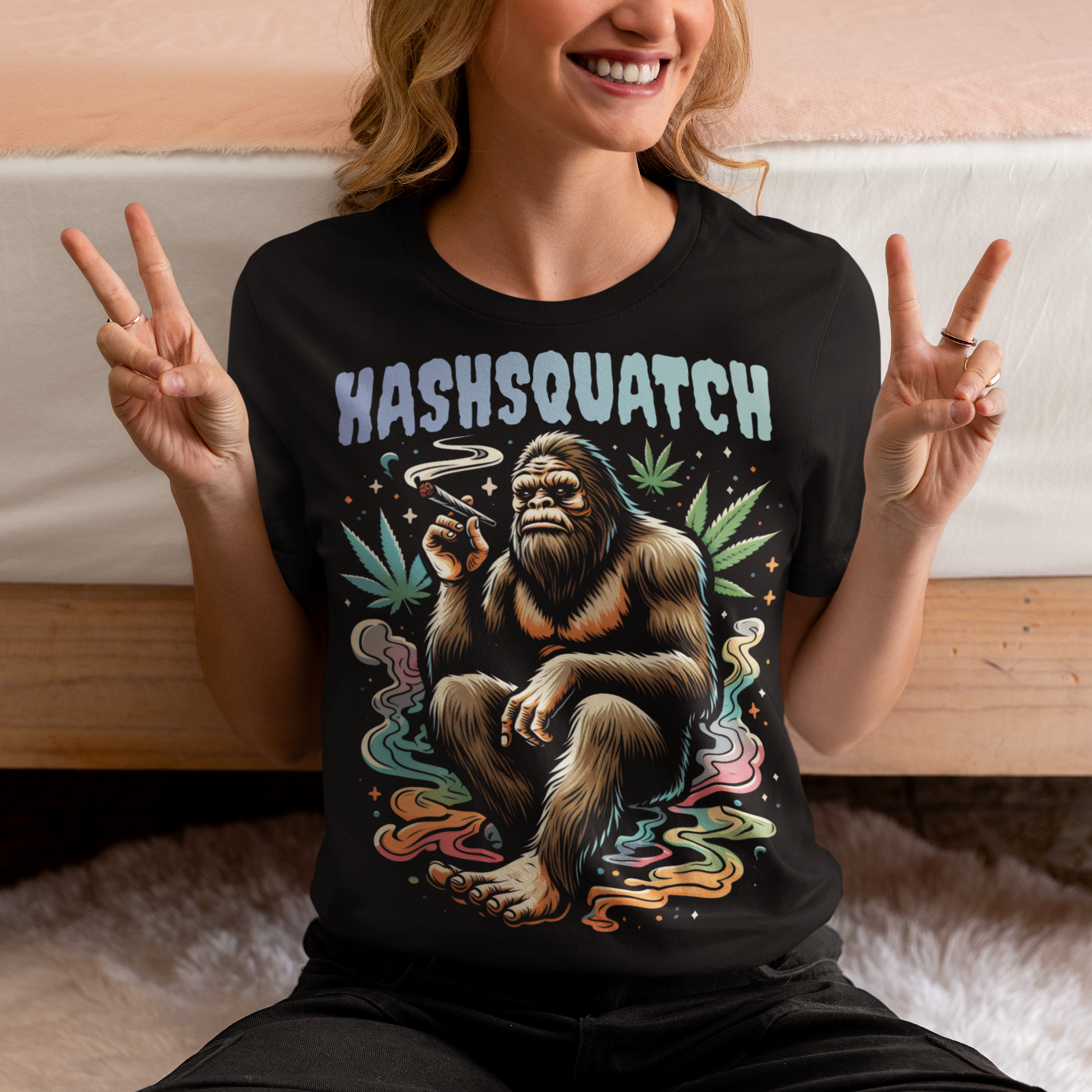 Black t-shirt of a Sasquatch smoking weed with text above HASHSQUATCH.