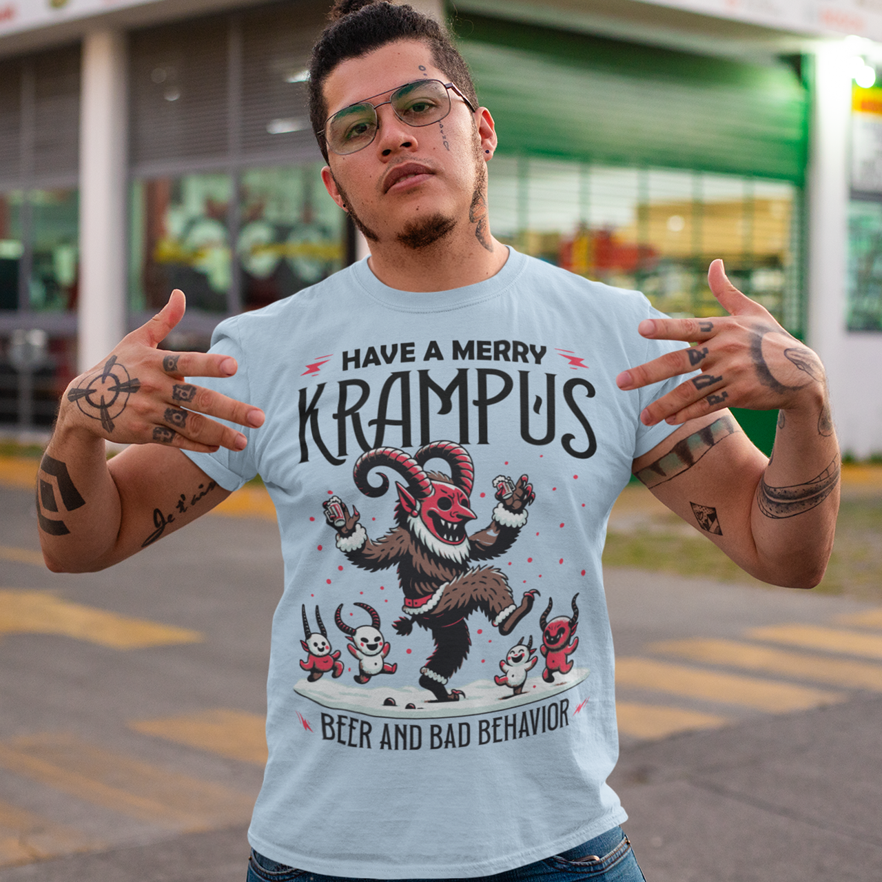 Light Blue t-shirt of Krampus partying at Christmas and text "HAVE A MERRY KRAMPUS."