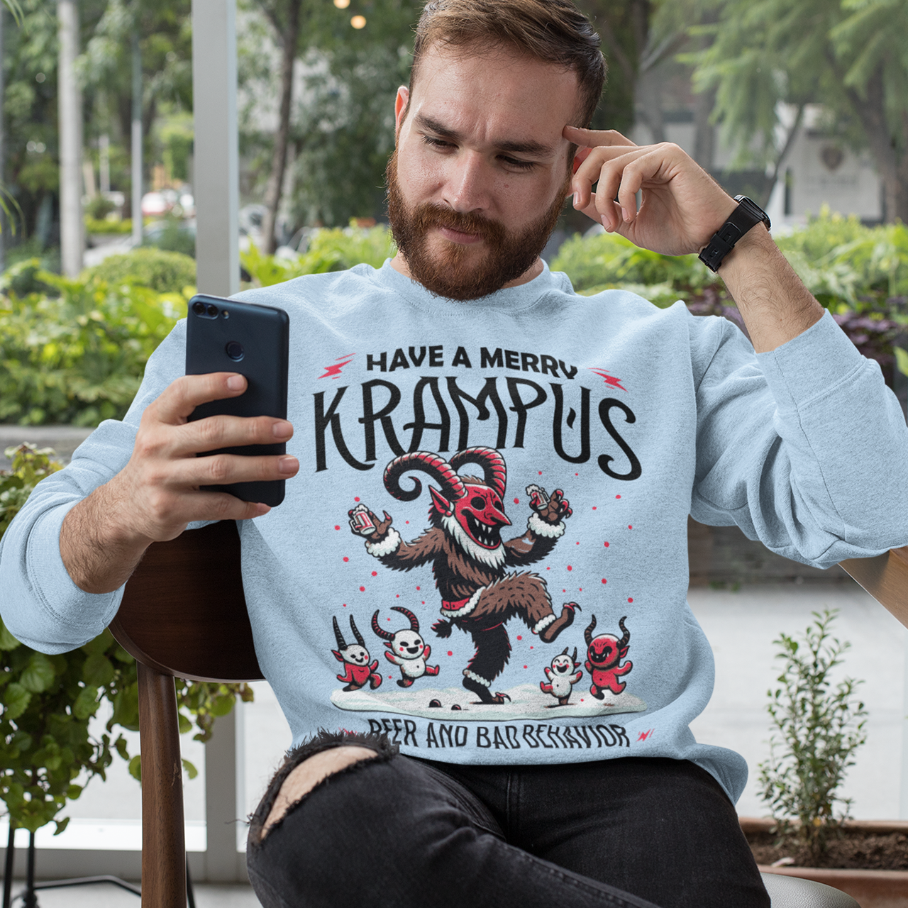 Light Blue sweatshirt of Krampus partying at Christmas and text "HAVE A MERRY KRAMPUS."